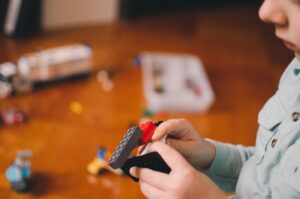 Child playing with Legos